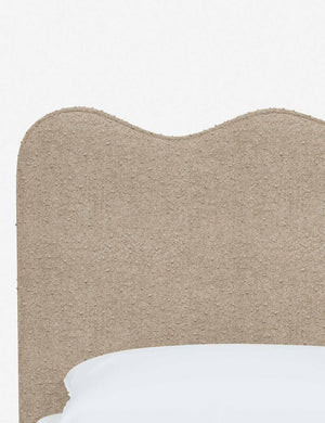 Close-up of the undulating lines on the headboard of the Clementine buff boucle platform bed