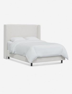 Angled view of Adara white velvet upholstered bed.