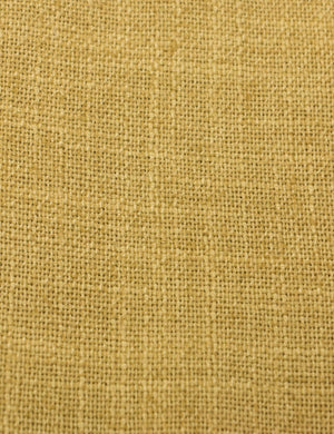 Detailed shot of the yellow linen on the Adara yellow linen upholstered bed.