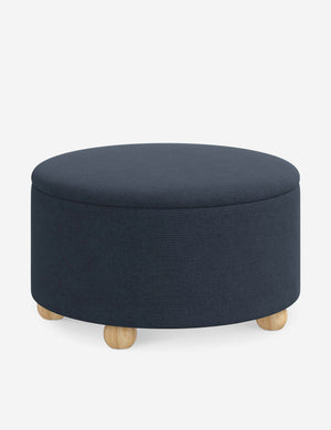 Angled view of the Kamila Navy Linen 34-inch ottoman