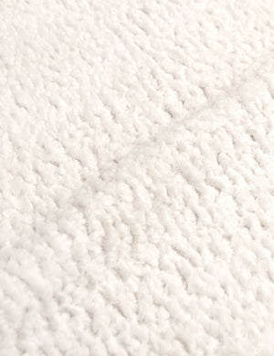 Detailed shot of the boucle fabric on the Adara cream sherpa upholstered bed.