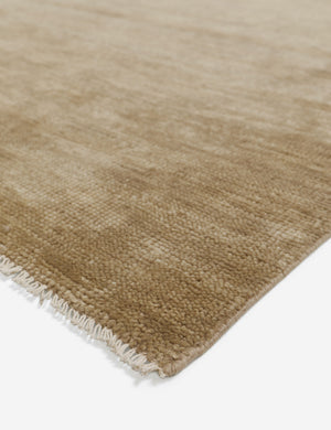 Fringed corner of the heritage moss gray rug