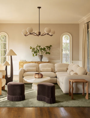 Nara fluted glass 5-globe chandelier by Aimee Song hanging in a living room