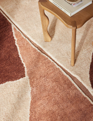 Close up view of the Amalfi Modern Organic Hand-Knotted Wool Rug by Aimee Song under a side table