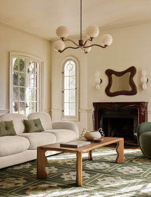 Nara fluted glass 5-globe chandelier by Aimee Song hanging in a living room