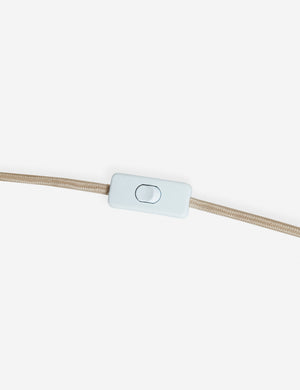 A beige cord with a rectangular white inline switch, designed for the Wrinkle Table Lamp by Sarah Sherman Samuel, is displayed against a plain white background.