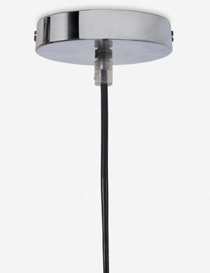 Close-up of the metallic ceiling fixture on the Paige black plush pendant light with palm tree fibers