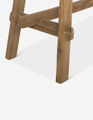 Close-up of the legs of the Arlene craftsman-style antiqued teak wood console table
