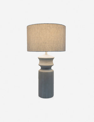Bhavanah Table Lamp with a gray spindle designed base with its light on