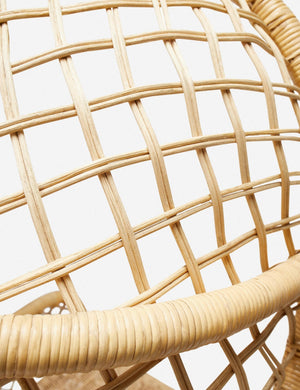 Detailed view of the woven rattan on the top of the Charley rattan accent chair with sloping back