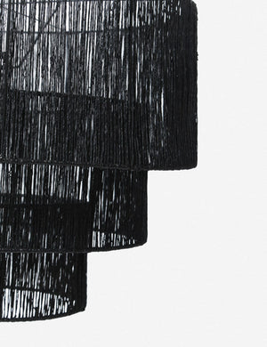 Close-up of the right side of the Chavette three-tiered black jute-wrapped chandelier