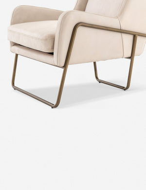 Angled view of the bottom half of the Dove ivory leather accent chair