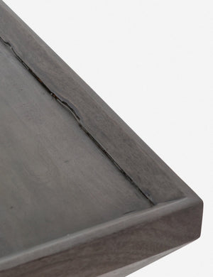 Close-up of the corner and walled border of the Alison geometric square coffee table