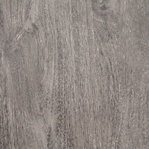 Detailed view of the light mango wood top on the Andra round coffee table with iron X-base
