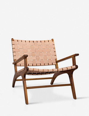 Angled view of the Jaslene beige woven leather accent chair