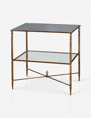 Angled view of the Nicolina side table with mirrored top and gold finish