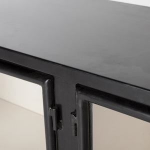 Hinge and joint detailing on the Marjorie black iron sideboard with glass paneled doors
