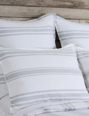 Close up of the Jackson Linen white and ocean striped Sham by Pom Pom at Home