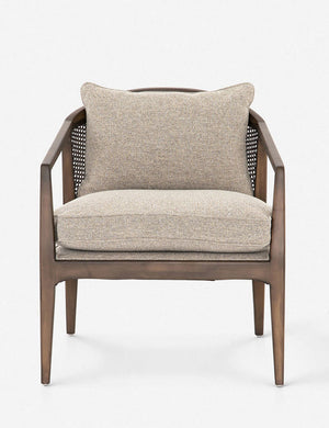 Rhea accent chair with natural-toned cushions and curved wicker back
