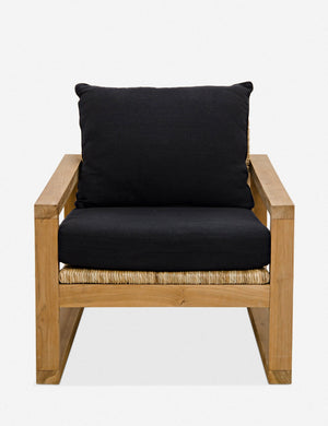 Regine wooden accent chair with black cushions and rattan detailing