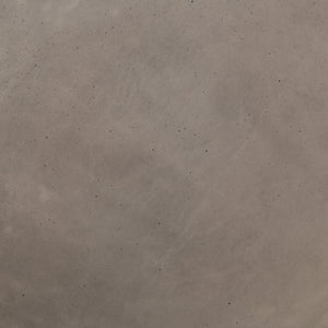 Detailed view of the concrete material in the Glyn concrete indoor and outdoor side table with carved finish